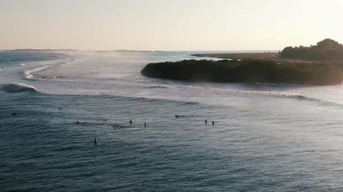 green island with white sand beach waves and blue lagoon surfing spot cokes
