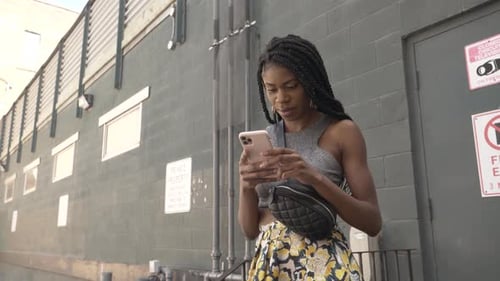 Stylish Woman Using Smart Phone in Urban Alley Adult