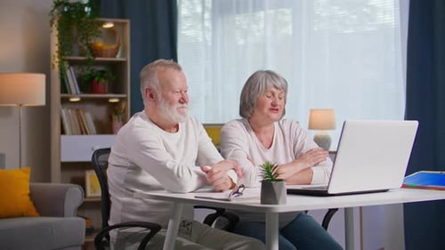 Senior Couple Enjoying Video Call At Home