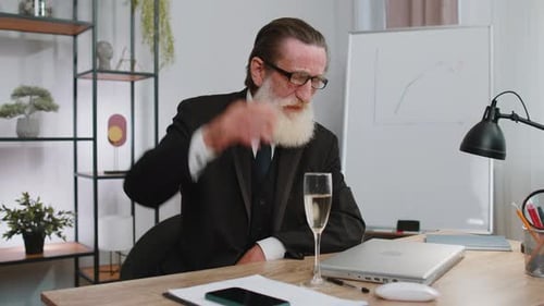 Senior Man Works, Celebrates with Champagne