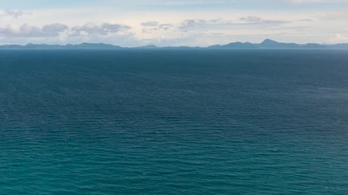 Blue Sea and Sky with Clouds