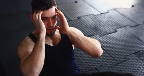 Man Doing Twist Crunches at the Gym