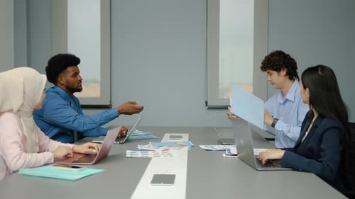 Diverse Group Meeting in Modern Office Space