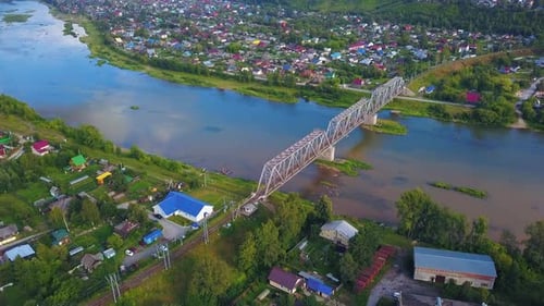 Top view of beautiful landscape of river and town with bridge