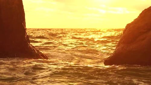 Sea Horizon Line with Waves on Golden Sunset