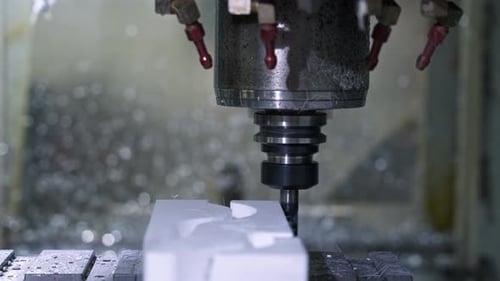 Milling Machine Carves White Material Cut Out