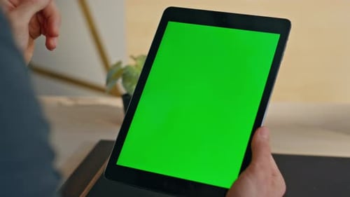 Employee Finger Swiping Greenscreen Tablet at Office Closeup Manager Using Tab