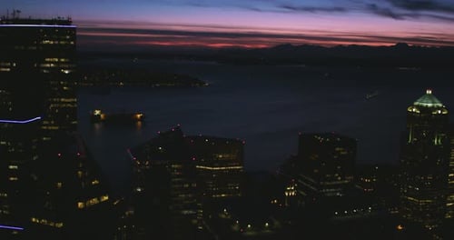 Cityscape Top Of Skyscraper Buildings Vast Horizon Mountains Sunset Red Glowing Clouds Large Bay