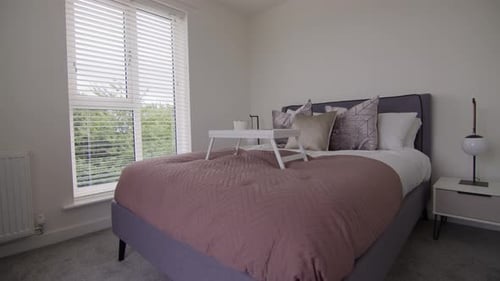 Clean Bedroom Interior with Natural Sunlight