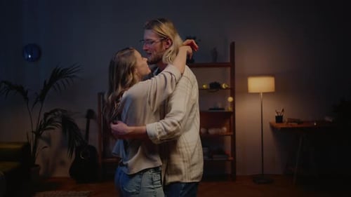 Loving Couple Dancing and Laughing at Home