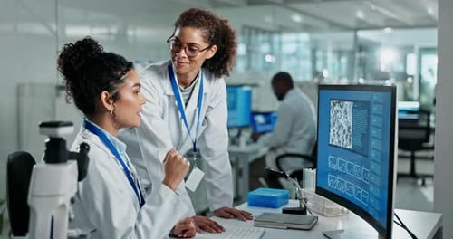 Science, teamwork and high five with computer in laboratory for test breakthrough