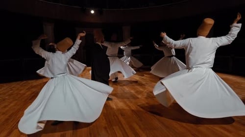 Whirling Dervishes Performing Traditional Dance in White Robes