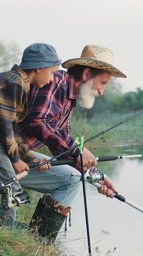 Side View of Attractive Respected Elderly Grandpa with Wellgroomed Beard in Straw Hat and Fishing