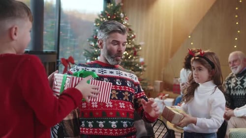 Family Celebrates Christmas Together with Gifts and Hugs