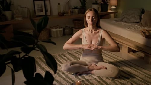 Woman Practicing Breathing at Home Helping Herself with Hand Movements