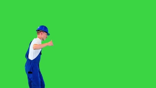 Happy and Excited Construction Worker Walking and Dancing on a Green Screen Chroma Key