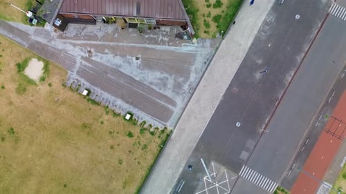 Rotterdam, South Holland, Netherlands - 09.06.2025 Aerial view of a triangular building near a beach