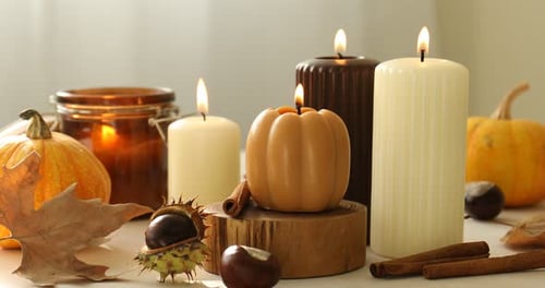 Autumn Still Life with Candles, Pumpkins and Leaves
