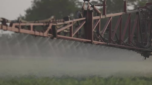 Agricultural Sprayer Spraying Pesticides on Chickpea Field