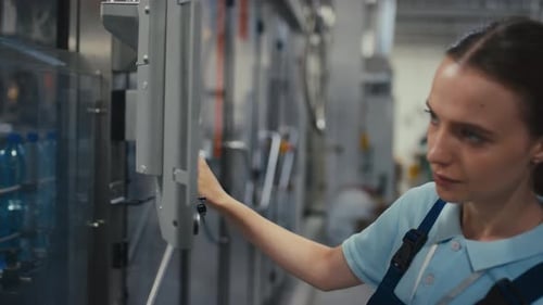 Engineering Technician Controlling Mechanism Operation at Water Plant