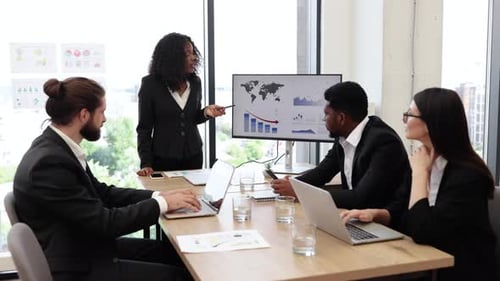 Business Meeting with Presentation and Teamwork in Office