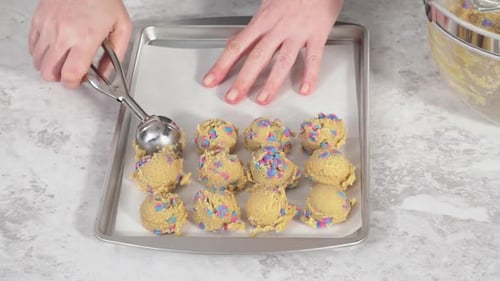 Scooping Cookie Dough with a Dough Scoop to Bake Unicorn Chocolate Chip Cookies