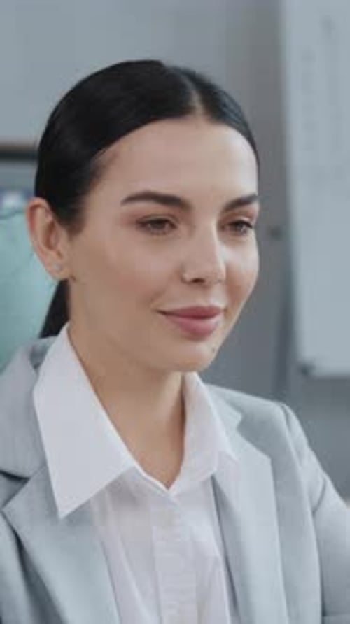 Smiling Young Woman in Business Attire