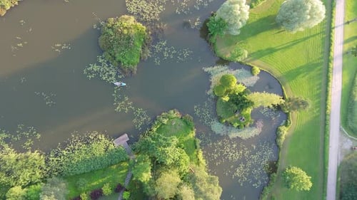 Young Woman Stand Up Paddling on Sup Board on Pond in Summer Aerial Shot