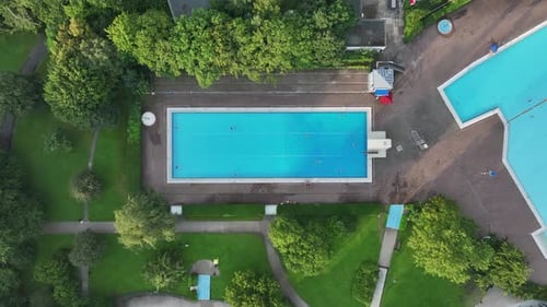 Aerial view of public pools surrounded by greenery, Germany.