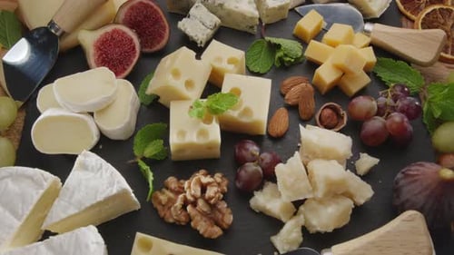 Delicious Cheese Board Appetizer with Fruit and Nuts