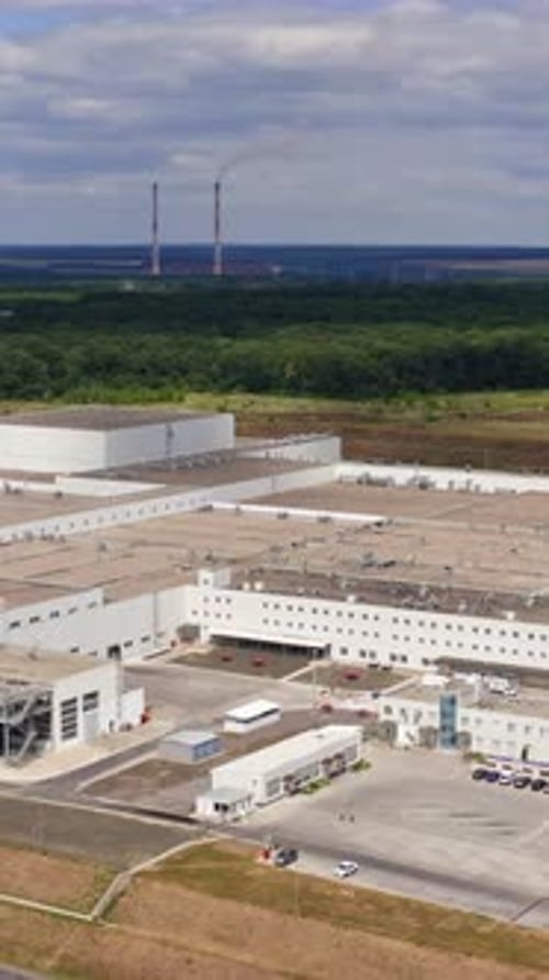 Large modern factory building. Machine building production site. Top view on facility. Aerial view.