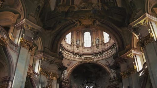 Interior of St. Nicholas Church, Prague, Czech republic - moving low angle shot 4K