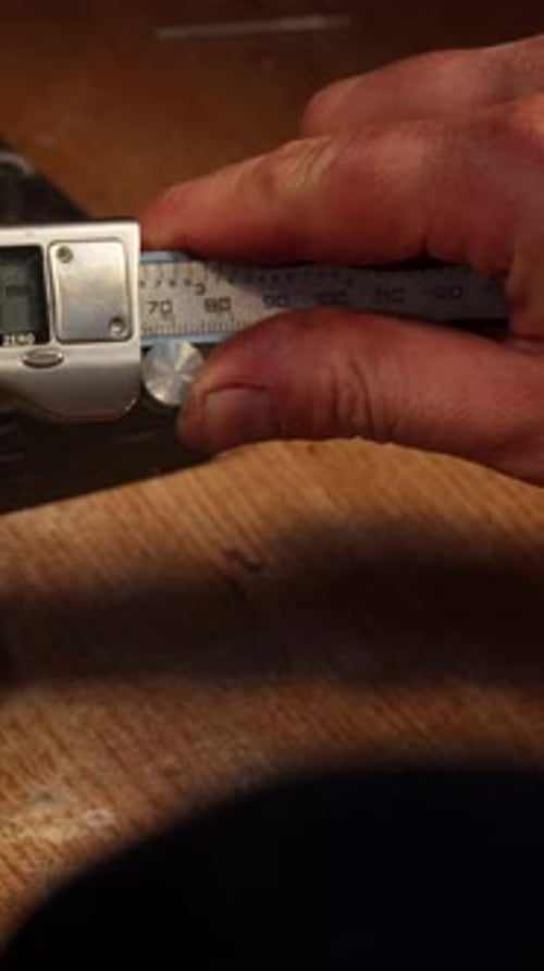Dedicated Jeweler Skillfully Measures Sparkling Zirconium Gemstones