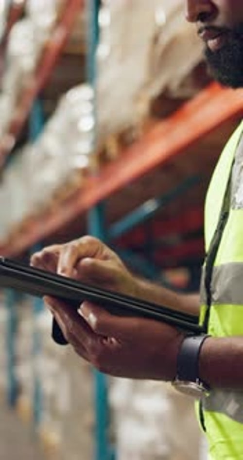 Inventory, logistics and man in warehouse with tablet, checklist and planning storage of stock