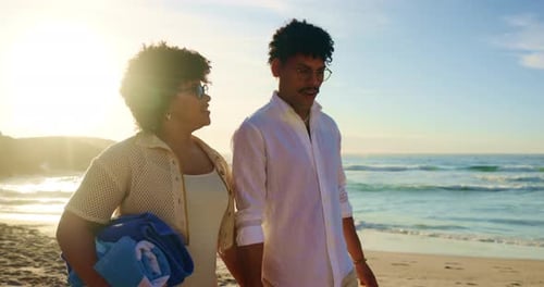 Couple, walking and holding hands with conversation on beach, romance and waves for love connection
