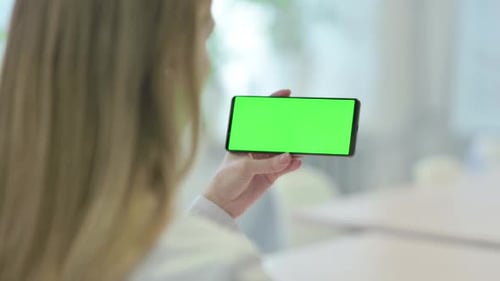 Woman Holding Smartphone with Green Screen Chroma Key