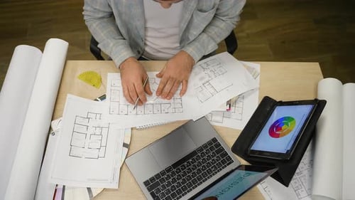 Architect Designer Developing House Blueprint Project in Office
