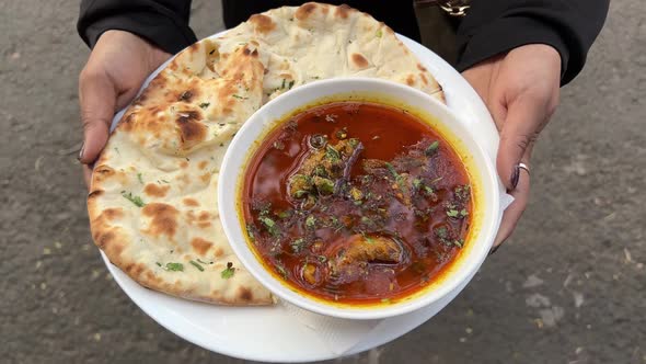 Served Mutton nihari with large dhaniya khameri roti during daytime ...