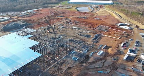 Crawler Cranes are Used in the Construction of a Industrial Warehouse on Construction Site