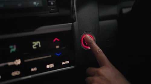 Hand push button to turn off car engine Follow to button Finger presses button to stop engine. Trans