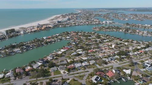 Aerial view of Treasure Island neighborhood with houses and waterways in Florida