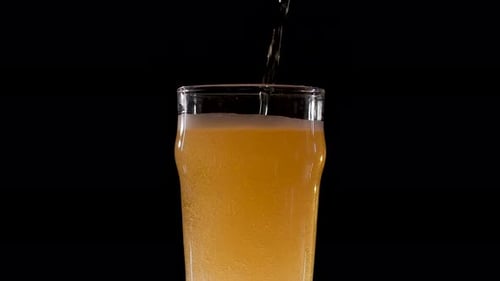 Light Beer Pouring Into a Glass