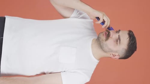 Young Adult Talking on Smartphone Video Call