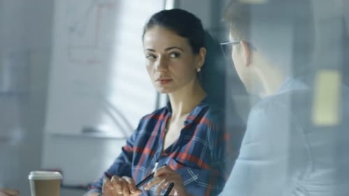 Mid Shot of a Team of Engineers Discussing Ongoing Project, Making Assessments, Sharing Opinions.