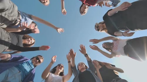 Group of Friends Joining Hands in Circle