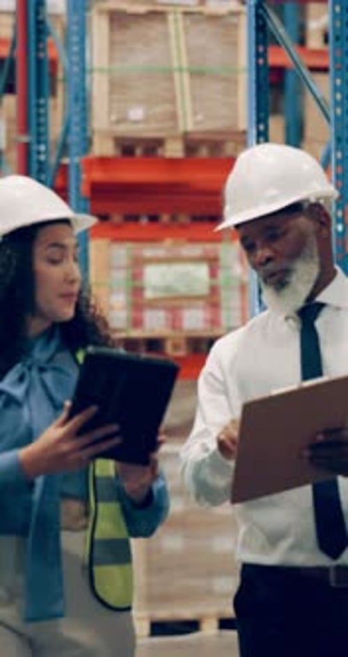 Walking, people and tablet for delivery in warehouse, talking and woman in logistics