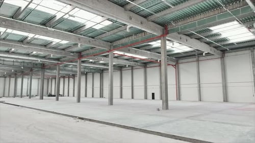 Footage of Bright Modern Logistics Warehouse Inside Drone View of Interior of Empty Huge Industrial