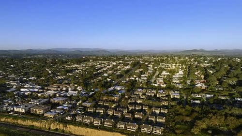Aerial view overlooking holiday homes on the coastline of San Diego, sunny evening in California,