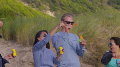 Group of Friends at Beach Blowing Bubbles Beach