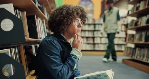 Student, thinking and reading a book in library for test preparation, study insight or knowledge